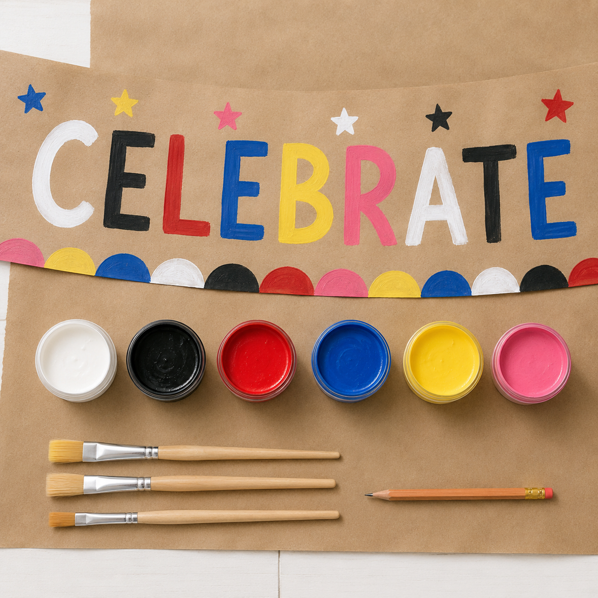 Six-color banner painting palette with Celebrate banner on brown kraft paper