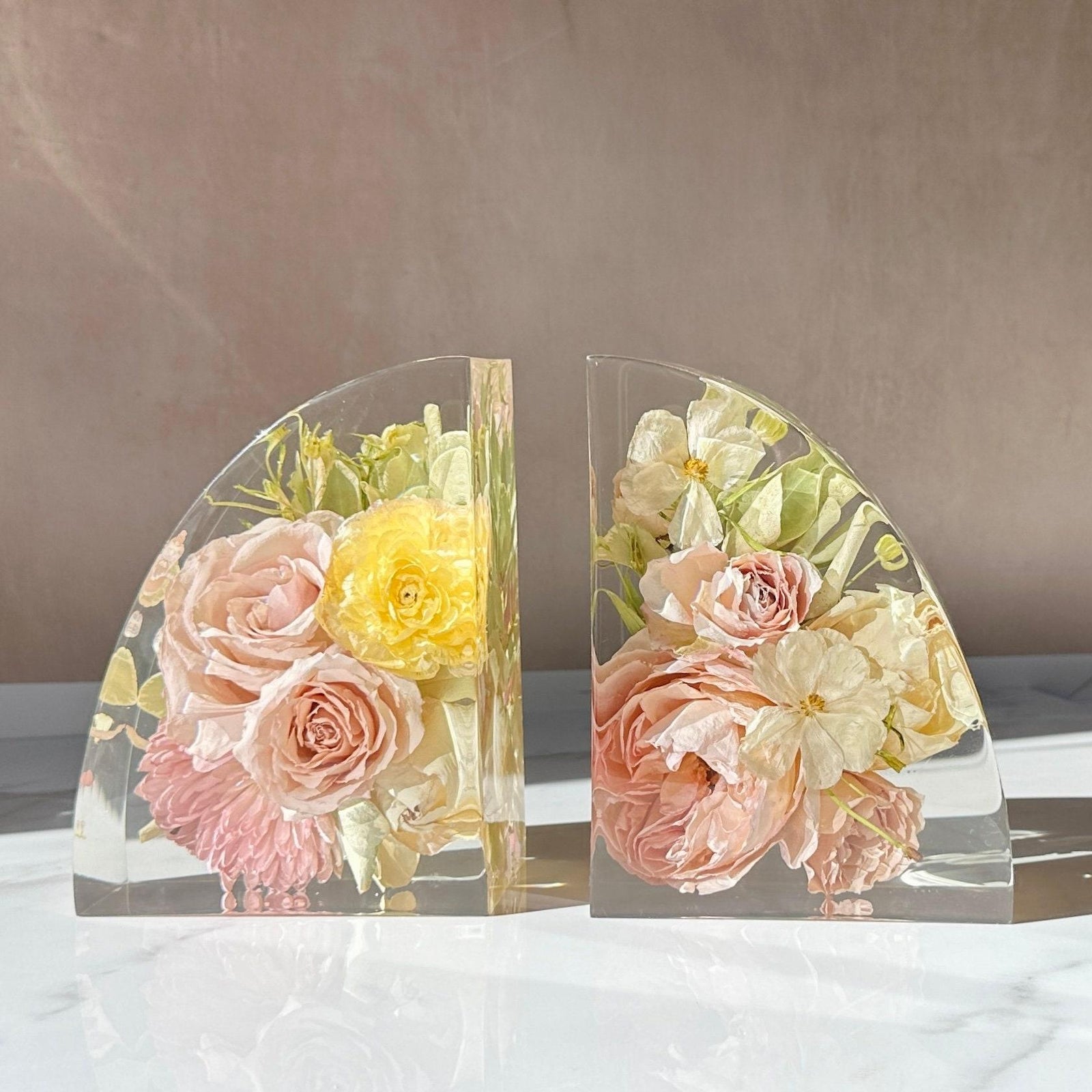 Wedding bouquet flowers preserved in clear resin bookends